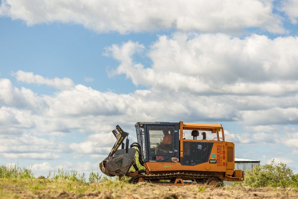 heavy duty machine clearing an acreage