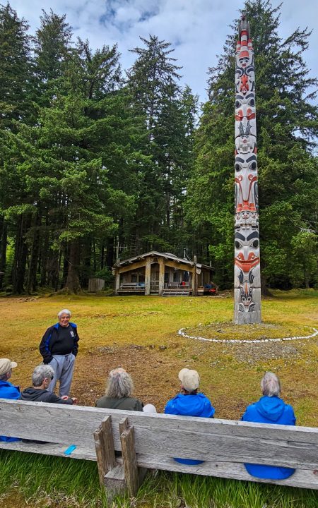 Beneath the watchful gaze of a monumental pole