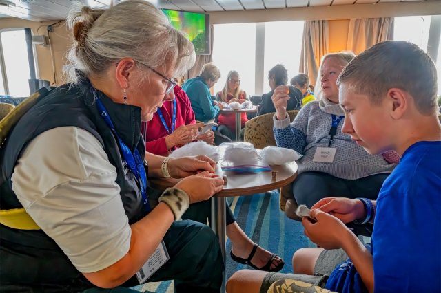 Inuit-guide-leads-beading-workshop-onboard