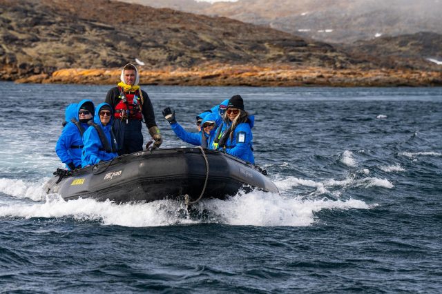 Zodiac from the bow with smiling guests