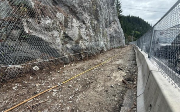Mesh wrapping around rock wall on Sea to Sky Highway