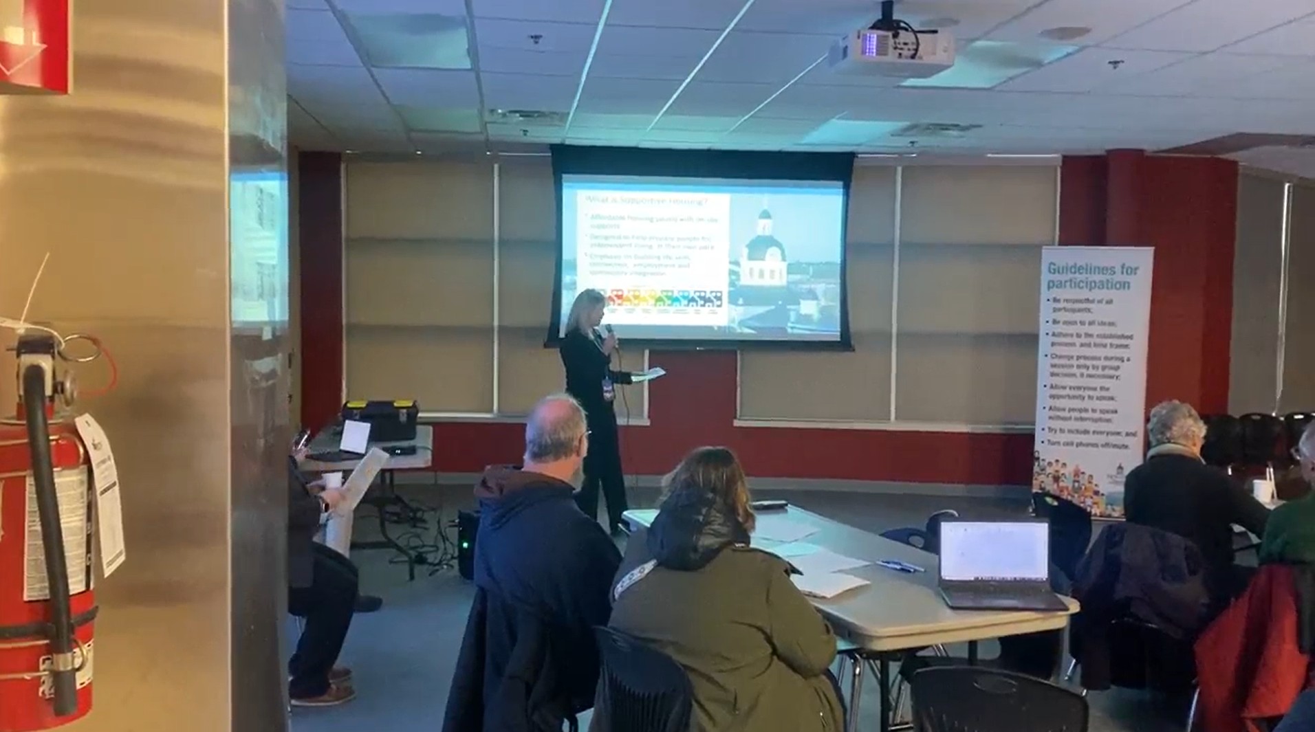 Staff present information to near neighbours of the new supportive housing site on Braemar Road.