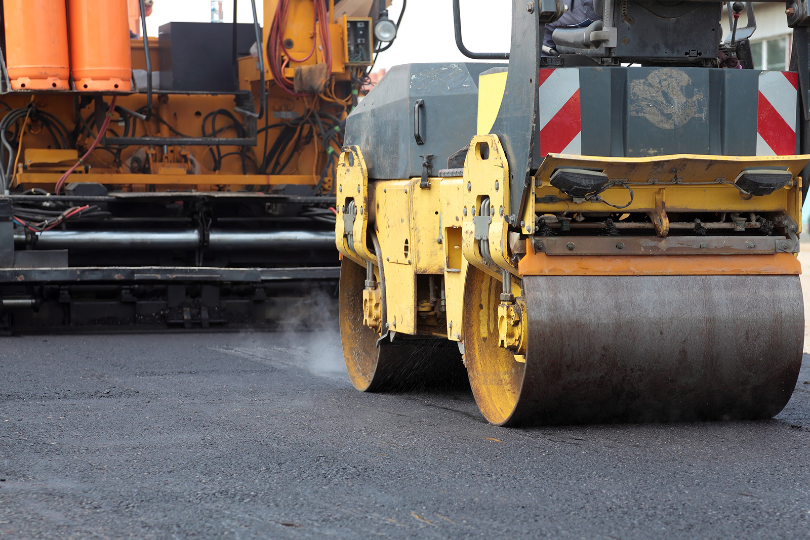 Paving equipment on new asphalt road