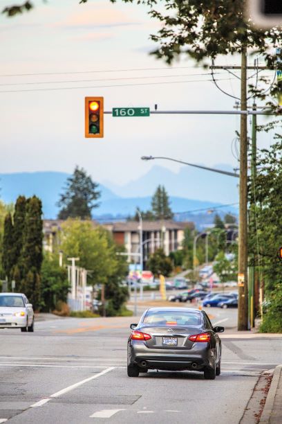 Photo of cars driving on Fraser Highway at 160 Street intersection in Fleetwood.