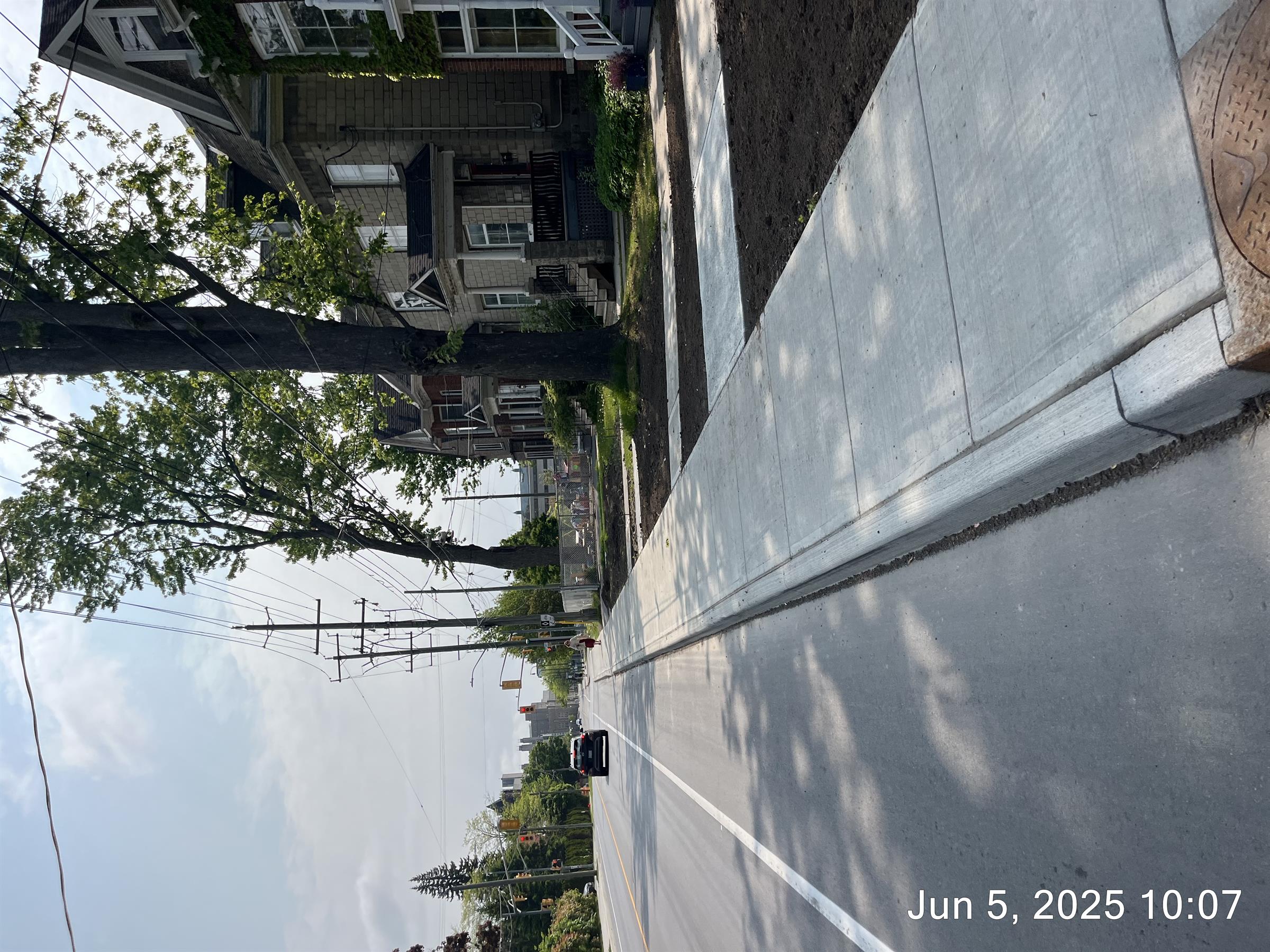 The new streetscape on Victoria Street featuring new sidewalks, curbs and bike lane. 