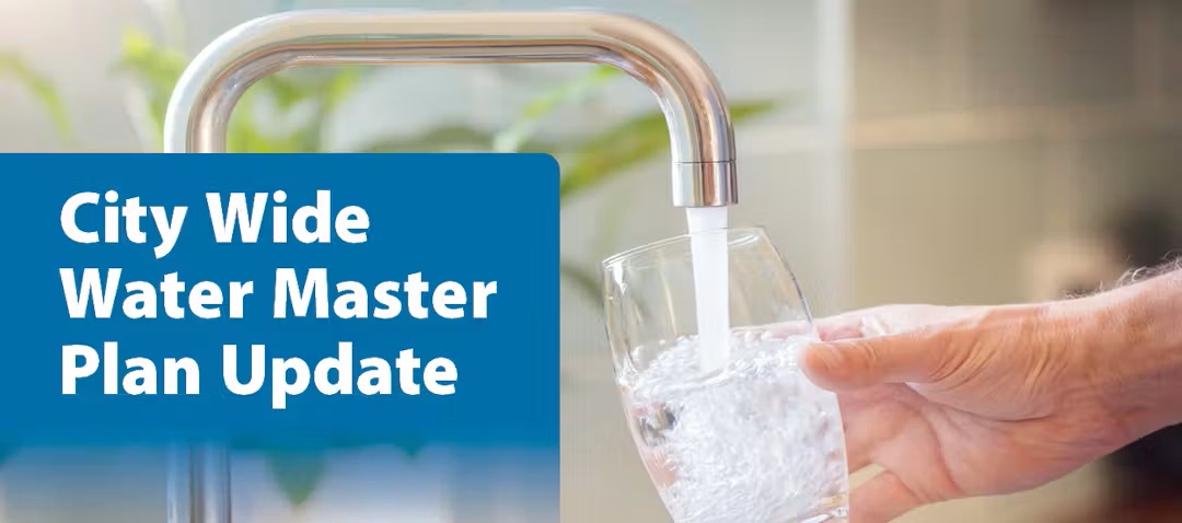 Person filling glass with tap water. Text reads City Wide Water Master Plan Update.