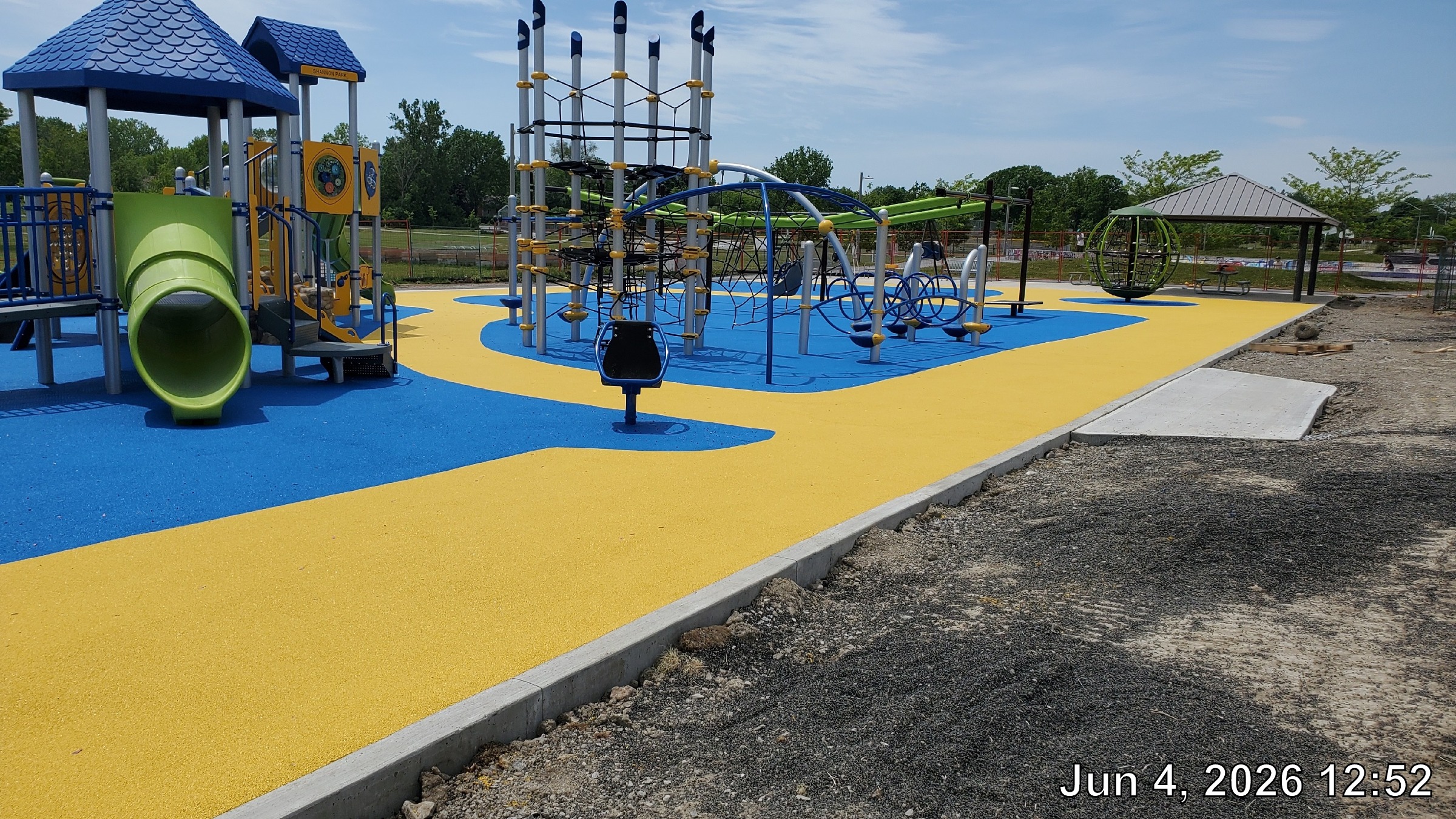 Completed playground structures and rubber surfaces. 