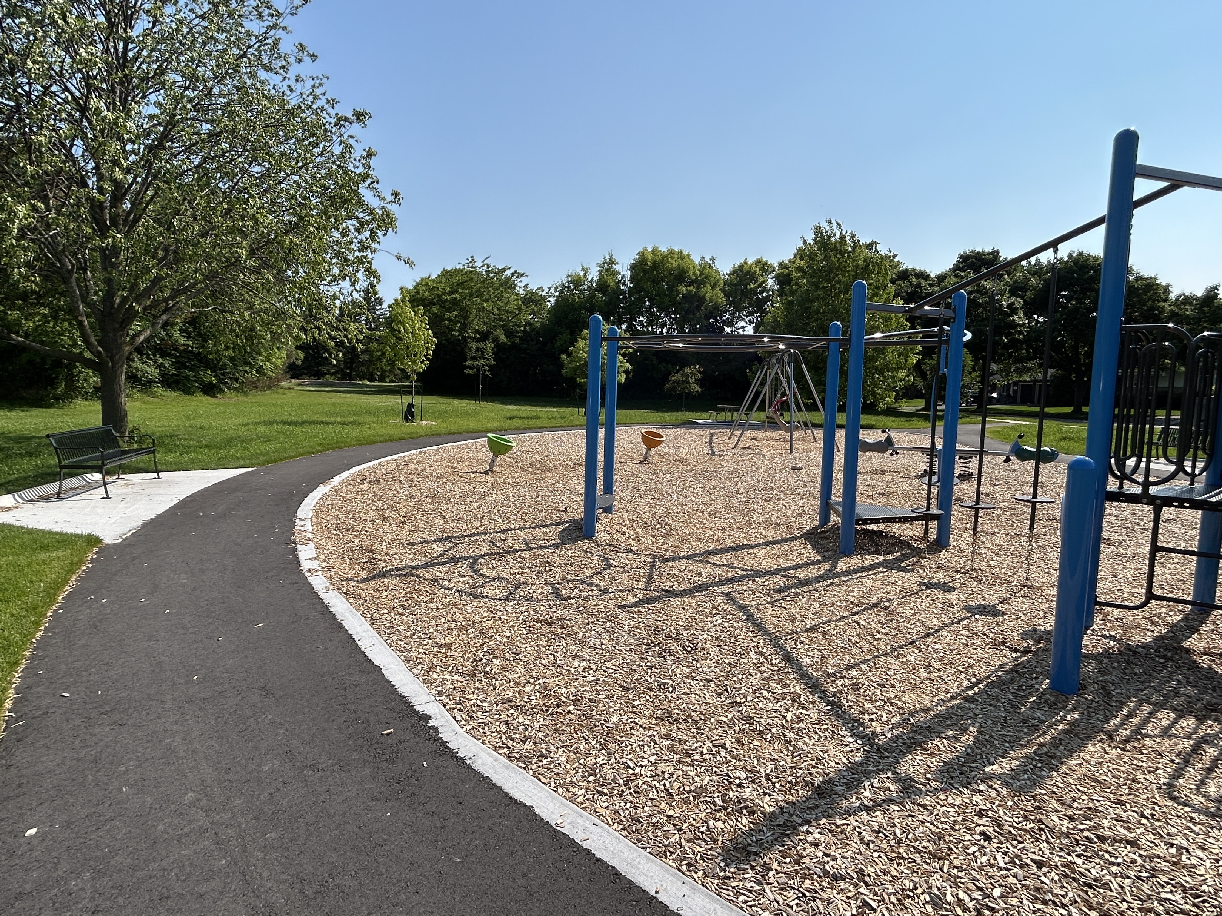 An updated playground at Rodden Park with new walkway, seating and vegetation. 