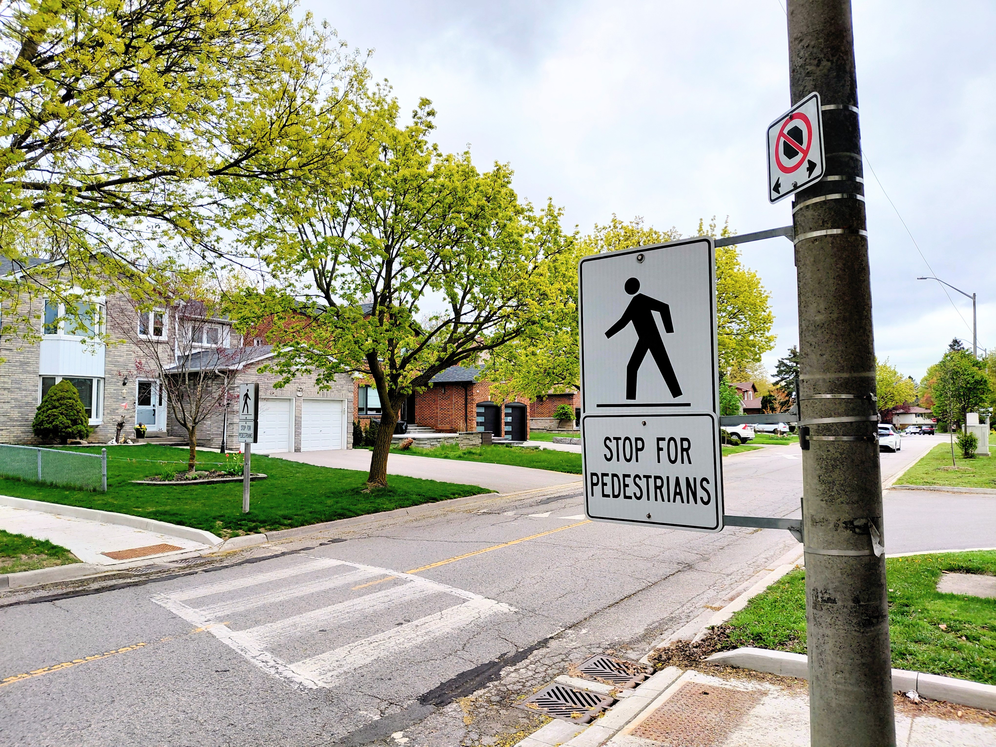 Pedestrian crosswalk street sign.