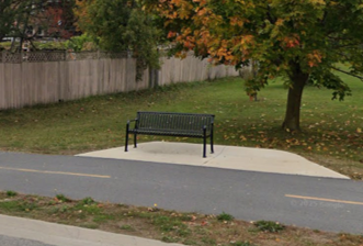 Example of an existing rest area bench with concrete pad