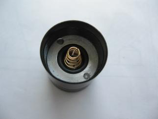 Cleaning tailcap spring contact with cotton swab