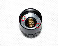 Tailcap showing two holes for retaining ring adjustment