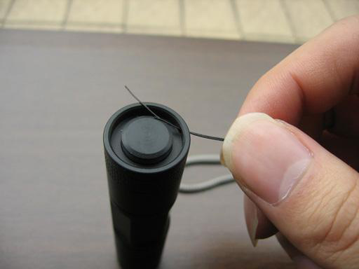 Threading filament through tailcap lanyard hole