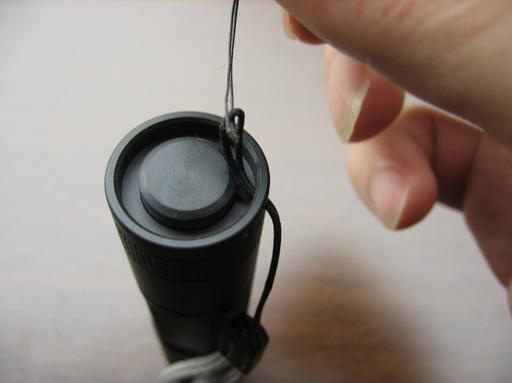 Pulling lanyard cord through tailcap