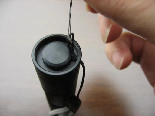 Pulling lanyard cord through tailcap