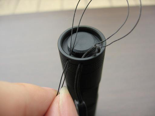 Feeding lanyard strap through loop