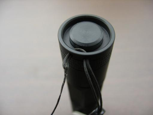 Pulling lanyard snug against tailcap