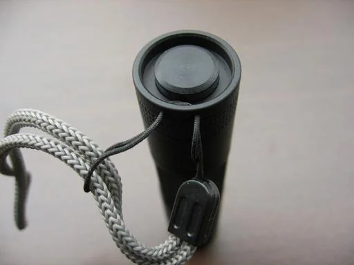 Lanyard securely attached to tailcap