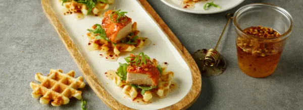 Spicy Breaded Chicken on Savory Cheddar Waffles 