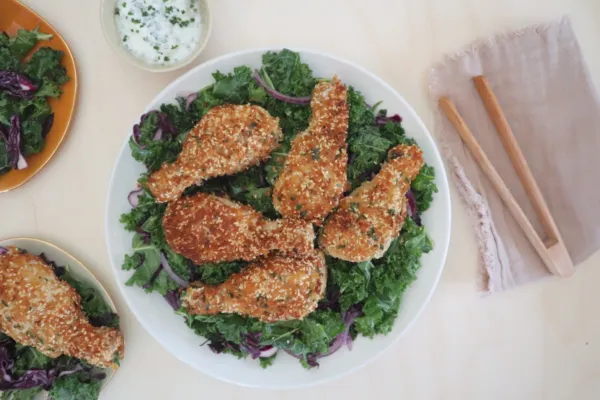 CRISPY CHICKEN DRUMSTICKS WITH KALE AND RED CABBAGE SALAD