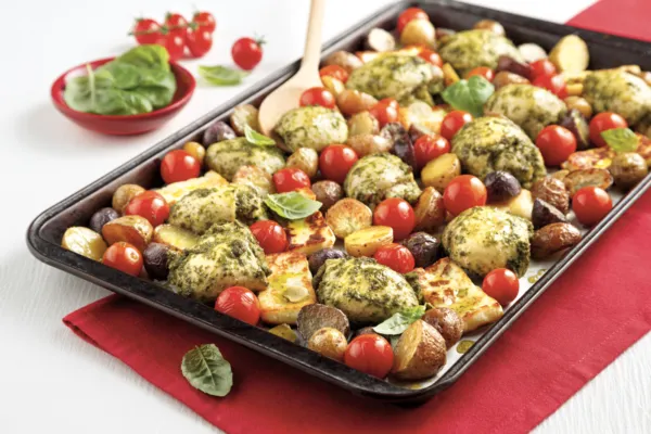 Thighs with pesto, tomatoes, and halloumi cheese