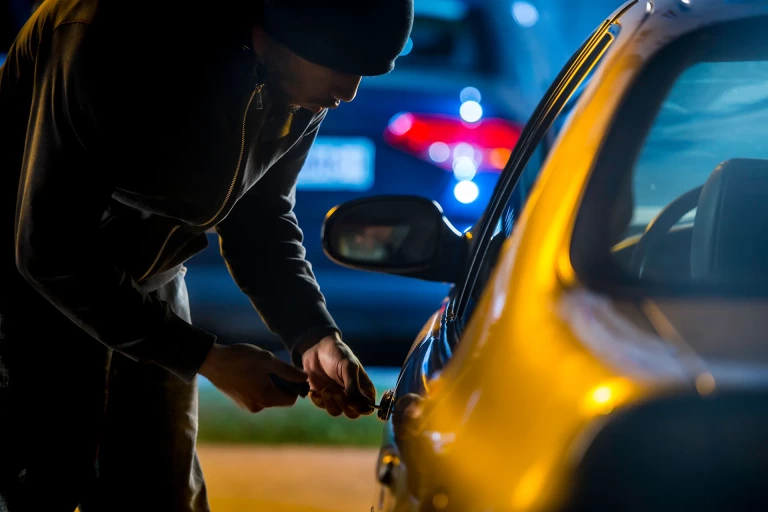Man breaking into a car