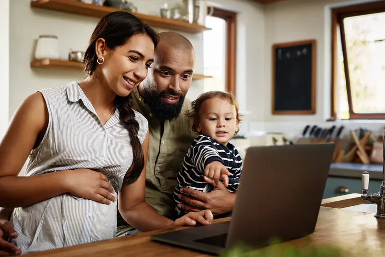 Family looking at a computer