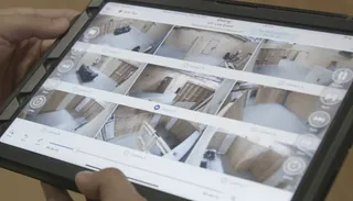 iPad showing multi-camera grid view of training facility