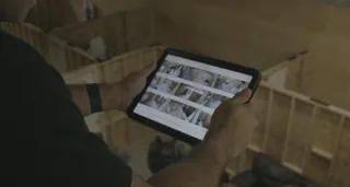Operator reviewing multi-camera grid on iPad