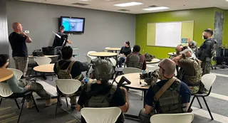 Tactical team reviewing training footage