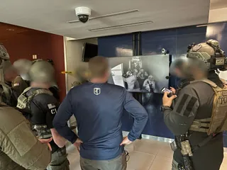 Tactical operators reviewing training footage