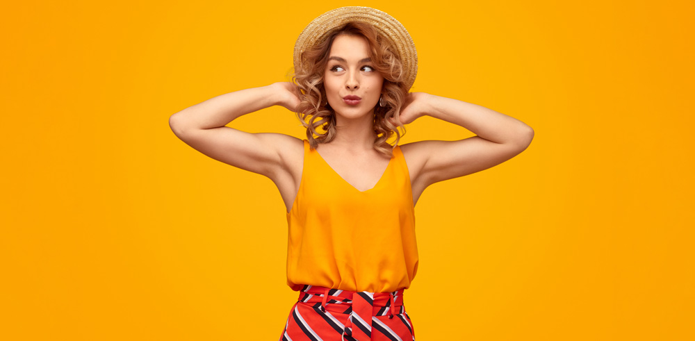 Thrifting Fashion Trends for Spring/Summer 2022 2 Woman wearing a colourful outfit she thrifted at Goodwill for Summer 2022