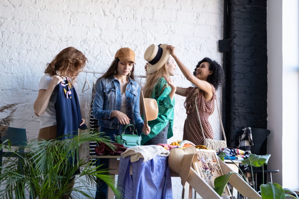How To Shop Like A Pro In A Thrift Shop In Edmonton 6 Group of friends thrift store shopping in Edmonton