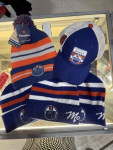 Oilers toques and hat at Goodwill Alberta store