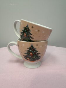 Two Christmas-themed decorative mugs