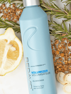 Volumizer Thickening Spray in use on fine hair