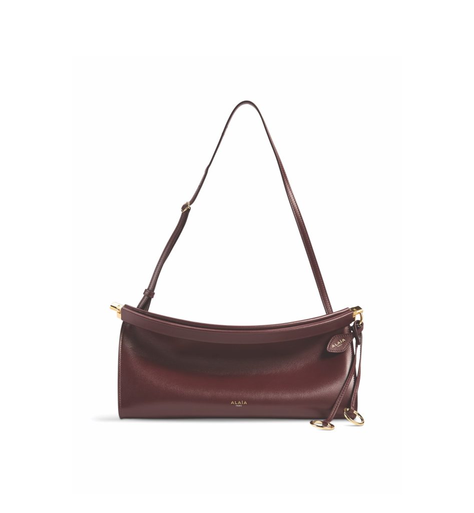 Dark burgundy shoulder bag with a thin strap.