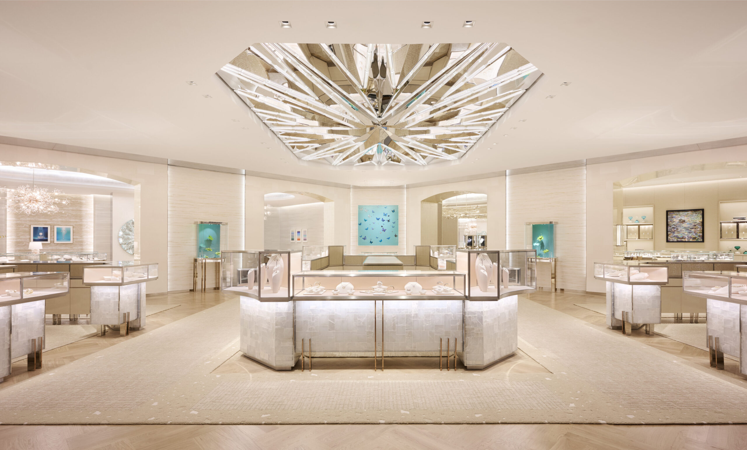 Luxury watch boutique interior with elegant display cases, featuring high-end timepieces and jewelry, illuminated by a striking geometric ceiling design, emphasizing the opulence of the pre-owned luxury watch market.