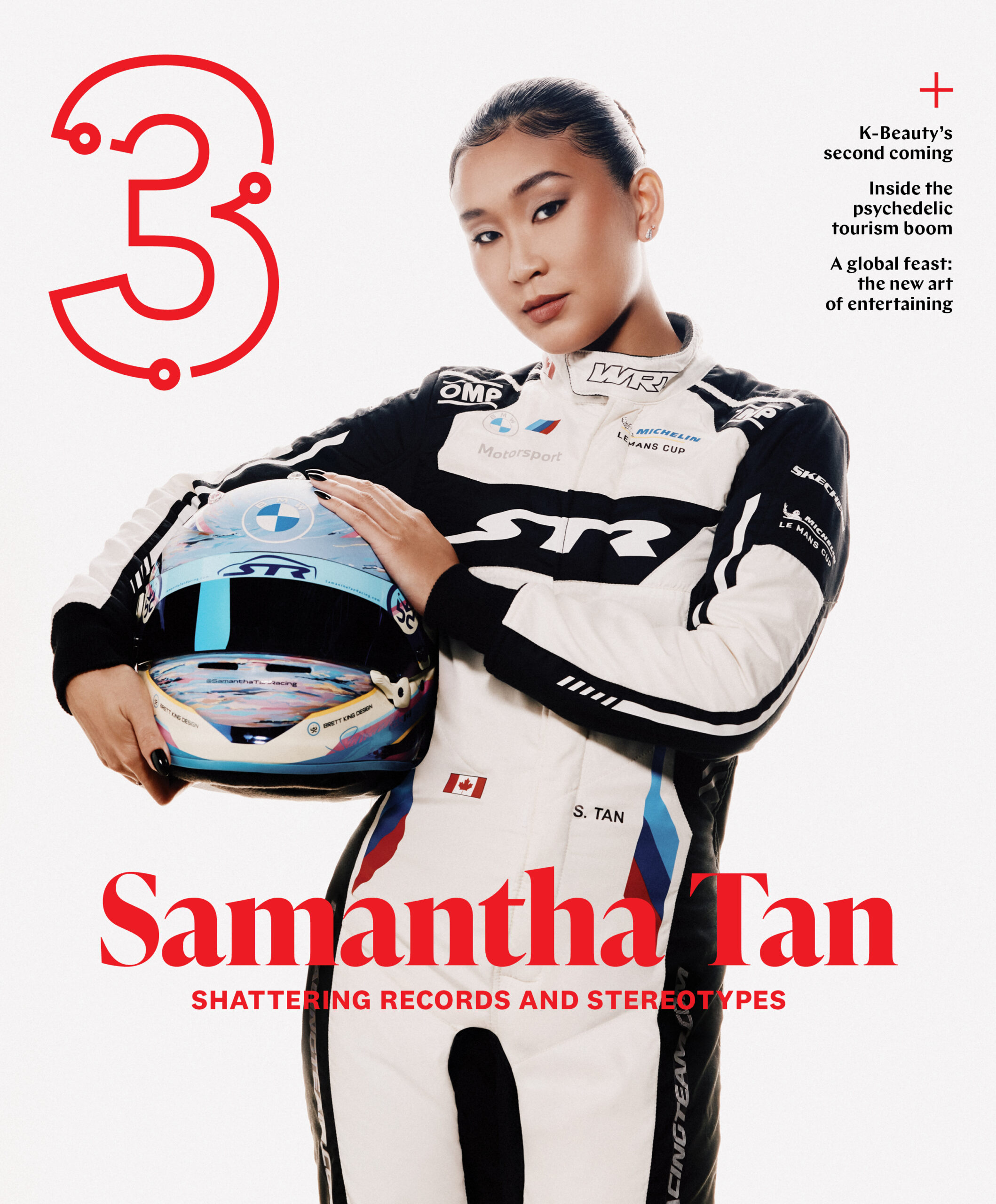 Samantha Tan in racing suit holding helmet, featured on Three Magazine Winter 2025 cover, highlighting her achievements in breaking records and challenging stereotypes.