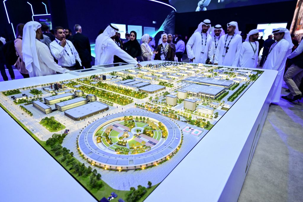 Guests look at a model of the largest data center in the UAE under construction in Abu Dhabi. 