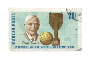 Vintage Gibraltar postage stamp commemorating the 1966 World Cup with a footballer, trophy, and tournament design.