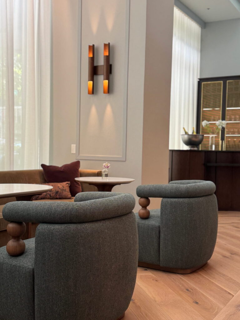 Modern lobby seating at Kimpton Hotel Monaco Seattle with sculptural chairs and warm wood flooring