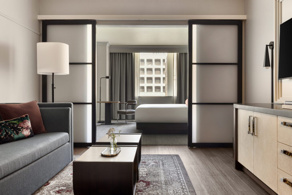 Suite interior at Kimpton Hotel Monaco Seattle with lounge seating and a separate bedroom