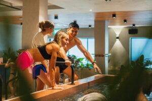 People preparing to take an ice bath at a wellness club