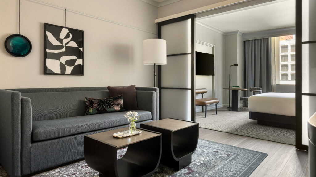Suite at Kimpton Hotel Monaco Seattle with a sitting area and bedroom
