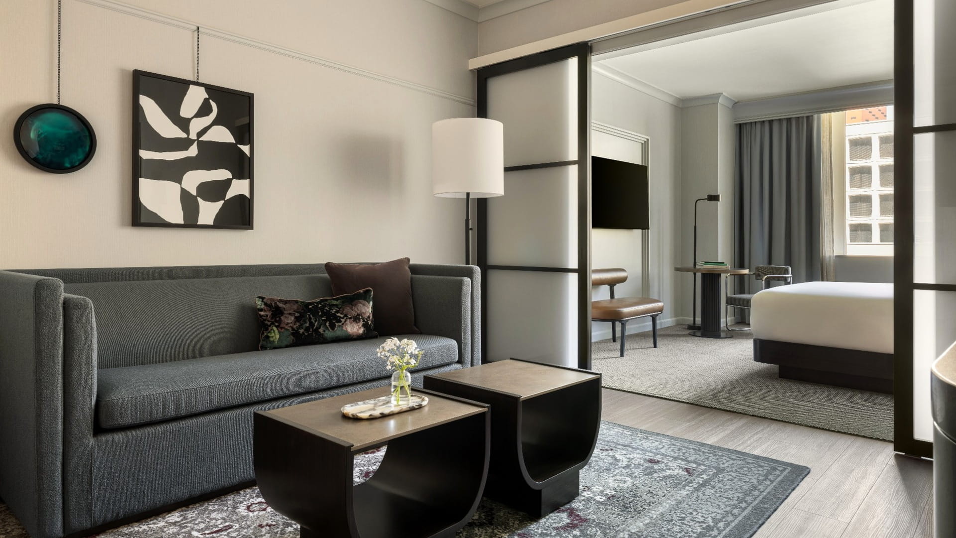 Suite at Kimpton Hotel Monaco Seattle with a sitting area and bedroom