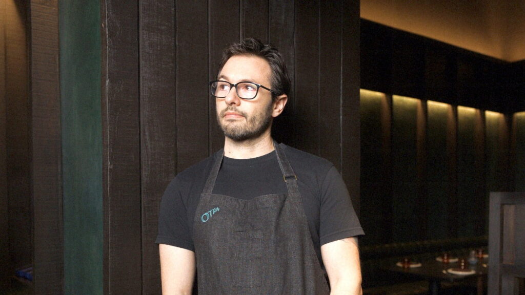 Chef Alex Sanchez standing inside Otra restaurant in Mumbai