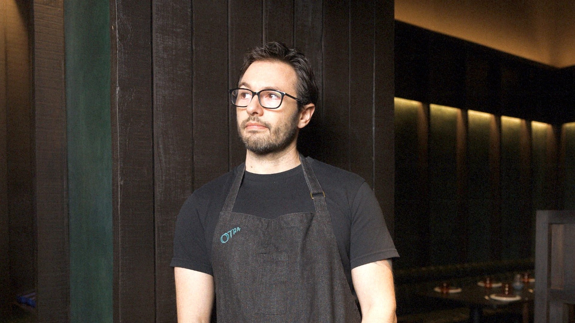 Chef Alex Sanchez standing inside Otra restaurant in Mumbai