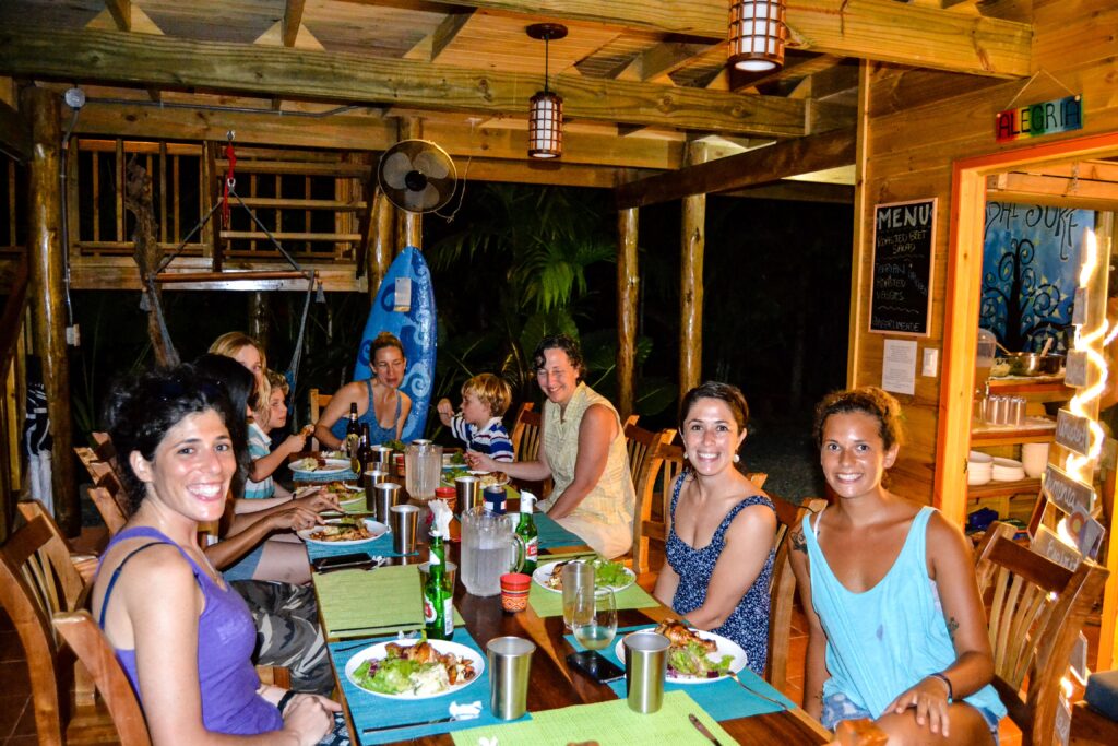 Guests enjoying an authentic, communal meal at the Bodhi Lodge, highlighting community and connection.