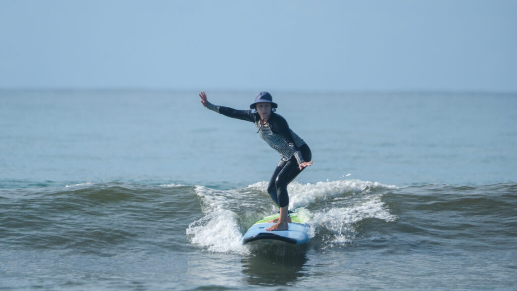 Surfing blue/green waves in Uvita, Osa, Costa Rica